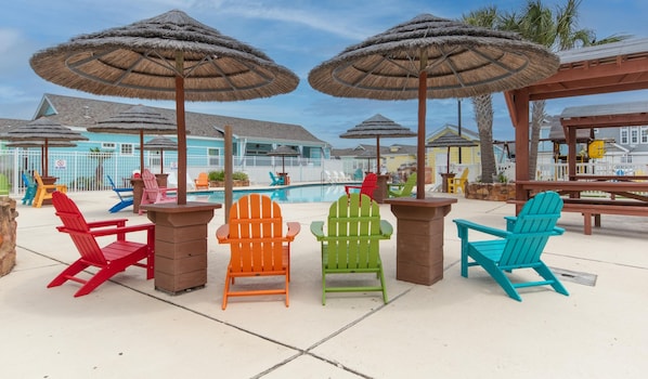 Pirates Bay has colorful adirondack chairs as well has plentiful chaise loungers and regular chairs