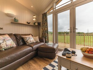 Comfortable seating within living area | Karelia Lodge, Keltyneyburn, near Aberfeldy