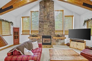 Great room/living room with vaulted ceilings, gas fireplace and entertainment