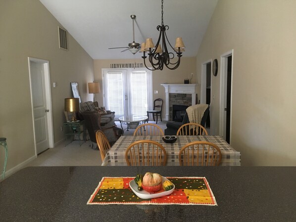 Open concept, view from kitchen. Two bedrooms each with a bath to left, 3rd rt.