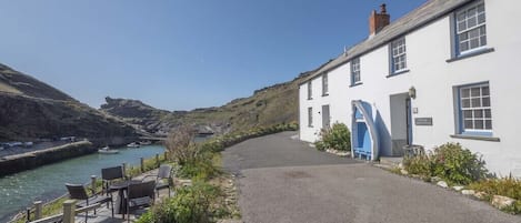 Gull Cottage with its blue boat-seat to the right & terrace to the left