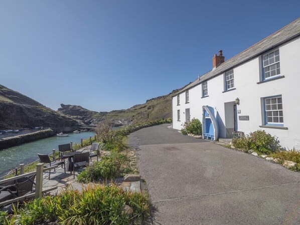 Gull Cottage with its blue boat-seat to the right & terrace to the left