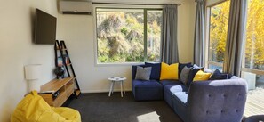 Lounge area with TV and sofa