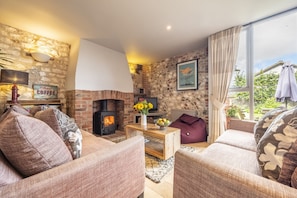 Cog Cottage, Great Walsingham: Comfortable sitting area with wood burning stove