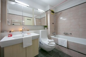 Bathroom with bathtub and bidet