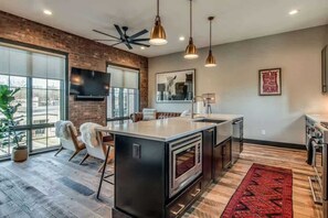 Enjoy staying in? Cook a Gourmet Meal in your Designer Kitchen with Professional Appliances
