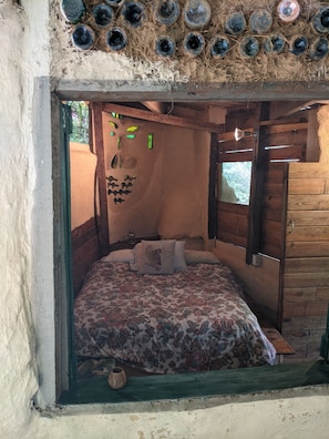 Looking into the main bedroom with it's big opening windows.