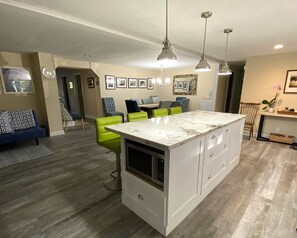 Open concept kitchen with island, opens into the dining area 