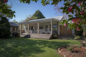 Spacious back deck steps into Norala Garden and on to the Ovens at back gate