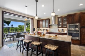 Fully equipped kitchen of this Kona Hawai'i vacation rental with stainless steel appliances.