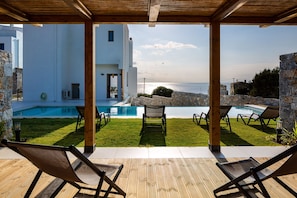 Outdoor living room under the shade of a pergola