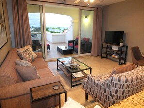 Living Area, with Sofabed couch.  Veranda in the background.