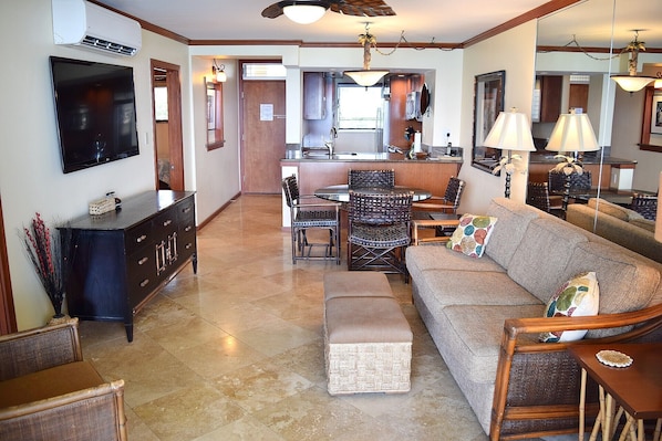 Spacious living area, comfortable couch and flat screen TV