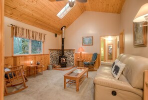 Features like the pine ceilings and log furniture add to the authentic cottage charm