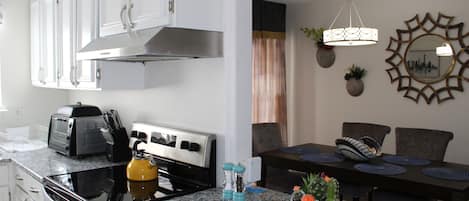 The kitchen opens to the dining room area.