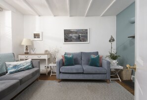 Cob Cottage, St Agnes. Ground floor: Cosy sitting room with television and wood burning stove