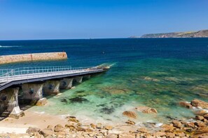 Sennen Cove is renowned for its beauty, with clear turquoise waters and golden sands