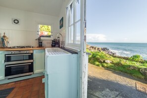 The Watch House, Coverack. Ground floor: Cook with a view