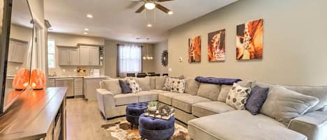 Living room with large sectional and cabinet electric fireplace