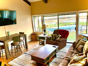 New 65" TV w/ Cable & view of the pool out back!
