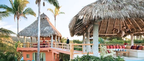 View of the living area with hot tub and connecting bridge