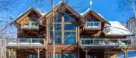 Stunning wood exterior with 4 private decks overlooking Sabin Lake!