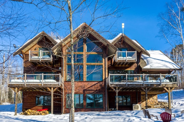 Stunning wood exterior with 4 private decks overlooking Sabin Lake!