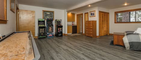 Full Size Shuffle Board Table, (3) Classic Arcades, and Wet Bar