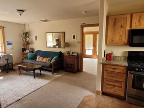 Living room and kitchen, looking towards bedroom