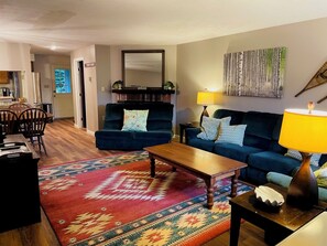 Living room from entry with bath and back doors beyond