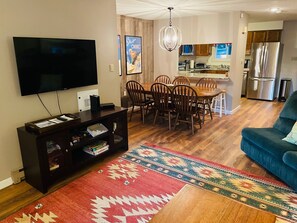 TV, dining and kitchen views