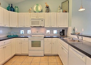 The main kitchen is on the second level & is open to the living & dining room.