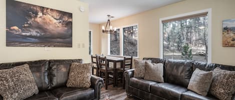 Mountain Getaway on the River - Midtown Riverfront 3 is a comfortable mountain escape situated in a wooded setting along the river. You can settle in and have a fabulous vacation here!