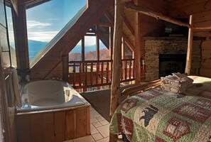 Main/upstairs bedroom with jacuzzi tub & view.