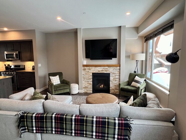 Relax in our cozy living room after a good day of skiing. 