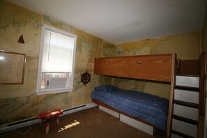 Bunks featuring secure but removable upper "fence".  Real charts for wallpaper!