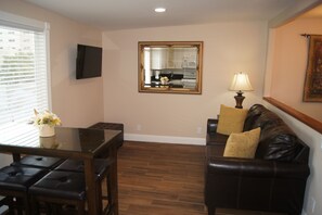 Living Area with Queen Size Sofa Bed and 40" 4K LED Smart TV.