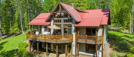 Large deck located off the main floor living room and kitchen