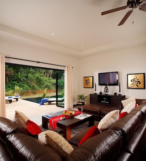 Living room opening to spacious garden