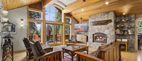 Main Floor Living room with a large stone fireplace