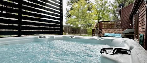 Hot Tub with covered pergola and open to patio