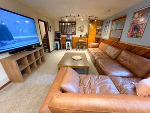 Basement theater and game room with 85" TV, arcades, books, and toys!
