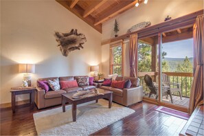 Upstairs Living Room with glass slider to upper deck.
