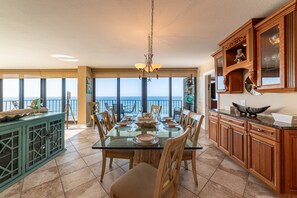 The elegant dining room features a dining table that comfortably seats 6 with additional seating for 3 at the bar. Enjoy making a cocktail at the custom bar.