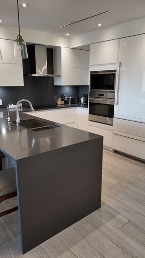 Spacious kitchen with Sub-Zero Wolf professional grade appliances.