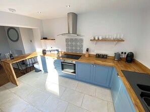 Shaker-style kitchen with breakfast bar | Florence Cottage, Heacham