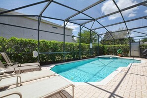 South facing saltwater pool with sun loungers.