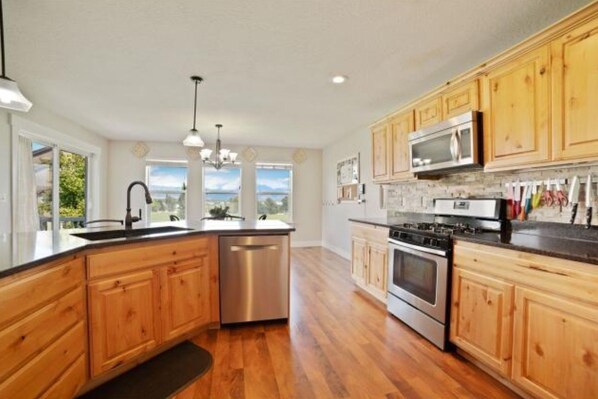 Gas range, dishwasher, microwave, and large bar