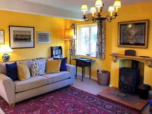 Cosy living room with wood burner | Orchard House, Hempstead, near Holt