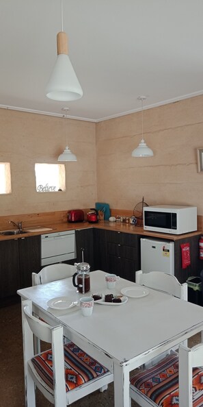 Modern kitchen and dining area.